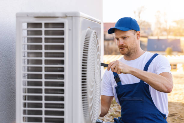 HVAC technician servicing an outdoor air conditioner in Laguna Niguel